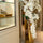 Phalaenopsis orchids cascading in a golden prism planter