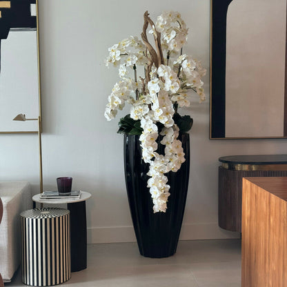 San Jose Vase in glossy black with hanging yellow orchids