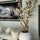 White magnolia tree in shiny white globe pot 30″